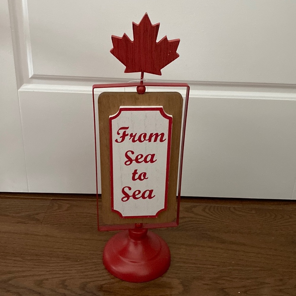 Canadian decor with metal base and wooden maple leaf
